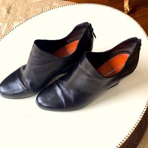 Black Leather 3 inch Booties zip up the back.